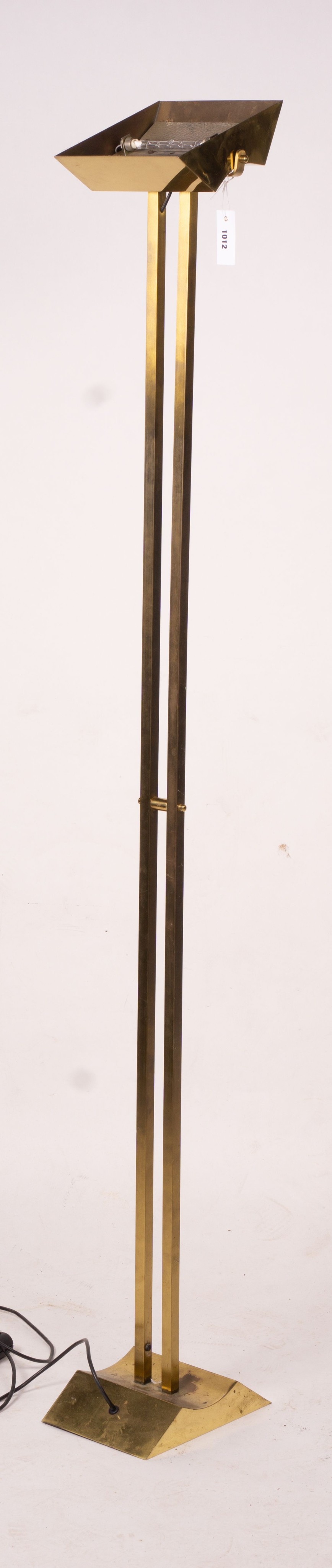 A contemporary brass uplighter floor lamp, height 180cm